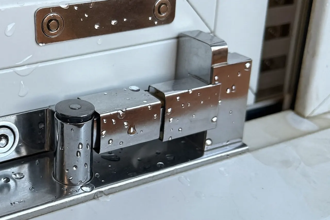 Close-up of a casement friction stay hinge on a window frame