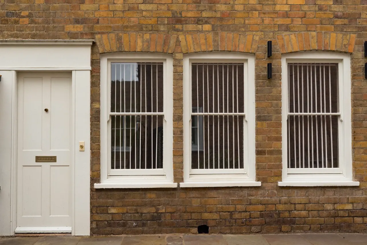 White sliding sash windows on a period UK terrace